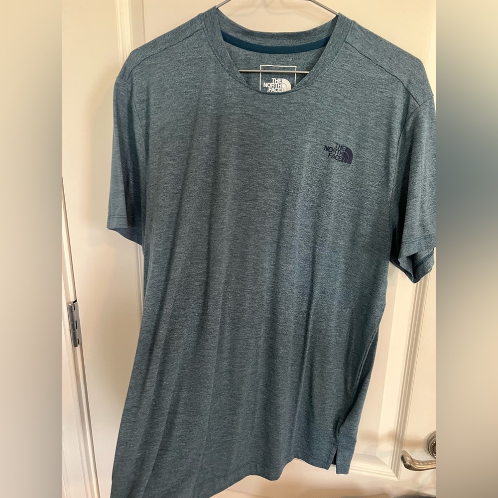 Men’s The North Face blueish teal athletic shirt.